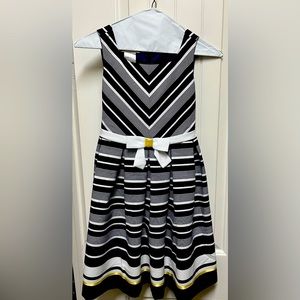 Blue, white trimmed in gold girl’s dress.